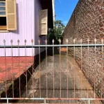 LOTE 001 - Casa de madeira  e lote urbano no município de Guarani das Missões